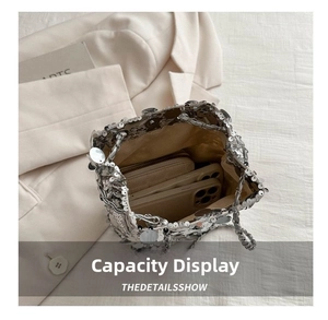 Silver sequin bucket bag interior view showing capacity for a wallet and smartphone