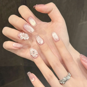 Handmade 3D white flower press-on nails with pink cat-eye gel finish and water drop charms
