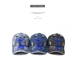 Detailed view of washed denim baseball caps with cute sheep embroidery and distressed finish