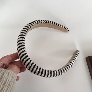 Detail of black and white striped sponge headband with premium brown lining