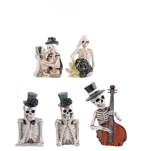 Detailed view of Gothic resin skeleton figurines including musicians and wedding couple