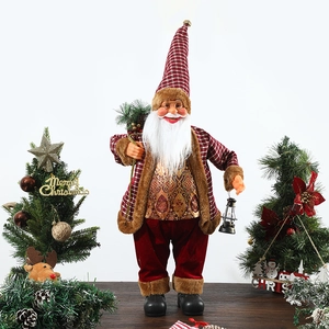 Standing Santa figurine with plaid jacket, lantern and backpack on wooden surface