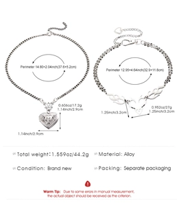 Detailed sizing of silver heart locket necklace and flame charm bracelet in alloy