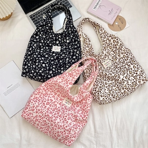 Three Korean style plaid canvas tote bags with heart patterns and brand label