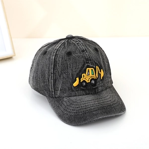 Macro detail of high-quality yellow excavator embroidery on kids washed denim cap