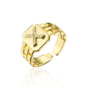 Macro shot of 18K gold plated cross ring featuring paved AAA zircon and adjustable chain band