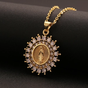 Golden Virgin Mary necklace with radiant cubic zirconia sunflower pendant on black background