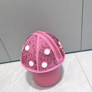 Detailed view of pink mushroom crossbody bag with sparkling rhinestones and white dots