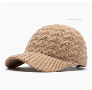 Detailed side view of khaki knitted baseball cap showing thick cable-knit texture