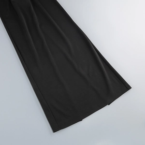 Detail of the black sexy dress showing the high-quality draped hemline and fine stitching