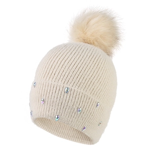Women's warm winter knit beanie in cream with faux fur pom pom and rhinestone accents