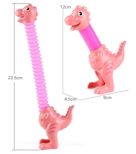 Pink dinosaur pop tube toy showing dimensions: compressed 12cm and stretched 23.5cm height