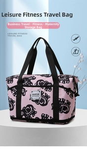Pink travel bag with elephant print showing spacious interior and sturdy handles