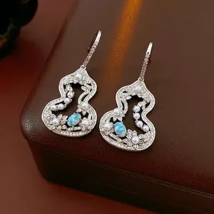 Luxe gourd-shaped drop earrings with blue gemstones, cubic zirconia and white pearls