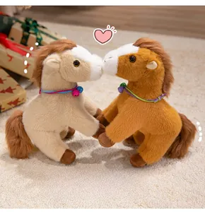 Detail of soft plush pony dolls with bell collars in a warm home setting