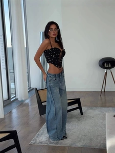 Women high waist wide leg blue jeans styled with black floral tie-front corset top