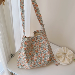 Detailed view of the soft floral cotton tote bag with orange and blue flower print