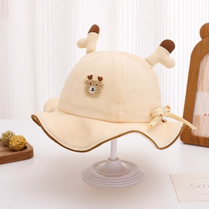 Close-up of beige baby bucket hat featuring 3D antlers and a cute animal patch