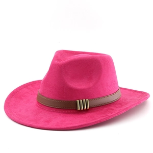 Detail of fuchsia suede cowboy hat with brown leather band and gold metal buckles