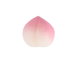 Mini TPR squeeze peach toy with realistic pink gradient texture on white background
