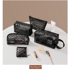 Detailed set of five black heart mesh cosmetic bags for travel and makeup storage