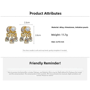 Detailed view of pearl earrings with teardrop rhinestones and dimensions 2.6x2.1cm