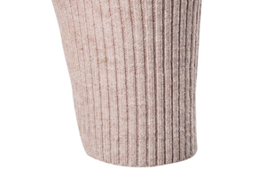 Close-up of oatmeal ribbed knit fabric texture on slim fit turtleneck sweater