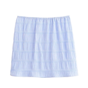 Detailed close-up of blue and white plaid mini skirt with elastic waistband on white background
