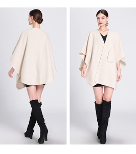 Front and back view of a beige knit shawl cape with front pocket and open-front design