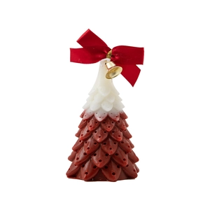 Gradient red and white Christmas tree candle with a red bow and golden bell detail