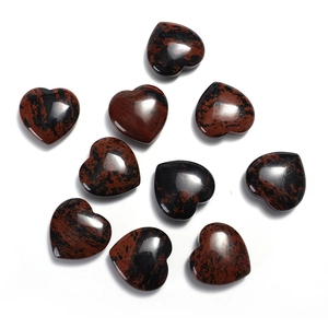 Macro shot of ten polished heart-shaped gemstones with deep reddish-brown patterns
