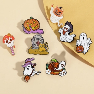 Detail of Halloween enamel pin set featuring ghosts and pumpkins on yellow background