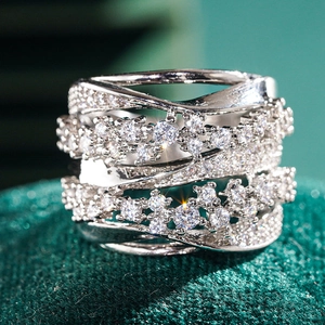 Close-up of wide multi-layer crisscross ring with micro-pave sparkling cubic zirconia