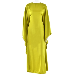 Detail of satin lime green maxi dress with elegant batwing sleeves and smooth drape