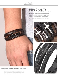 Detail of multi-layer braided leather bracelet with vintage metal cross and magnetic clasp