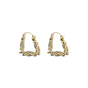 U-shaped gold plated earrings with sparkling zircon triangle drops on white background