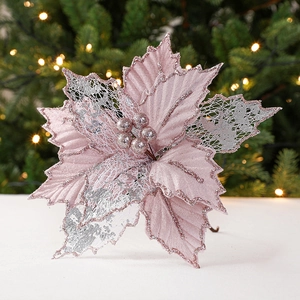 Pink poinsettia Christmas flower decoration with silver glitter and warm LED lights