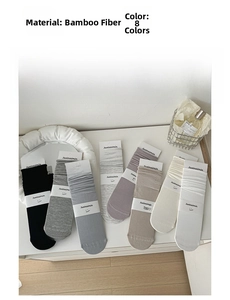 Detailed chart showing soft bamboo fiber texture and eight assorted colors of cotton socks