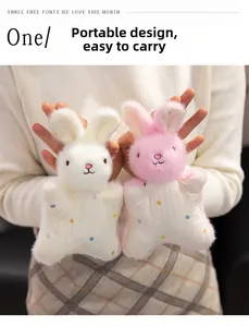Detail of cute rabbit plush finger puppets in white and pink with polka dot patterns