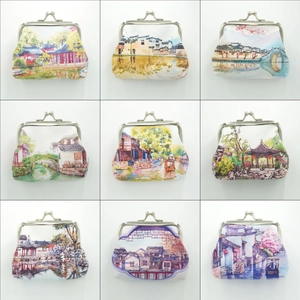 Collage of nine fabric coin purses with metal clasps in various artistic patterns
