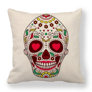 Close-up of bohemian linen pillowcase featuring a colorful Mexican sugar skull pattern