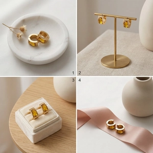Detail view of gold stainless steel hoop earrings with rectangle yellow gemstones in cases