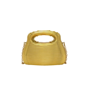 Detail view of the golden acrylic evening bag with a horizontal hollow-out stripe design