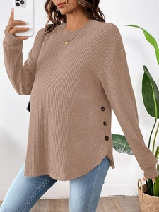 Close-up of ribbed maternity top with round neck and three side button details