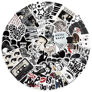 Close-up of waterproof black and white Y2K aesthetic stickers for laptop and DIY decor