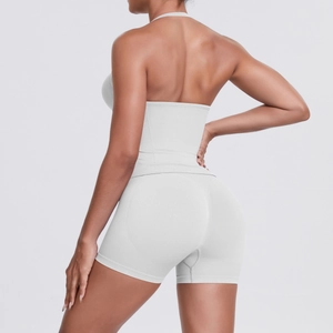 Detail view of racerback sports bra and high-waisted shorts in stretch fabric
