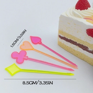 Detail of colorful plastic fruit picks in spade and heart shapes with size measurements
