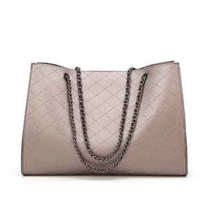 Brown metallic tote bag with quilted diamond pattern and double chain shoulder straps
