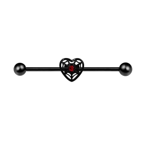 Industrial barbell piercing with black heart spider web design and red zircon stone