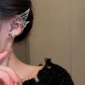 Silver butterfly wing elf ear cuff with hollow metal filigree design for women